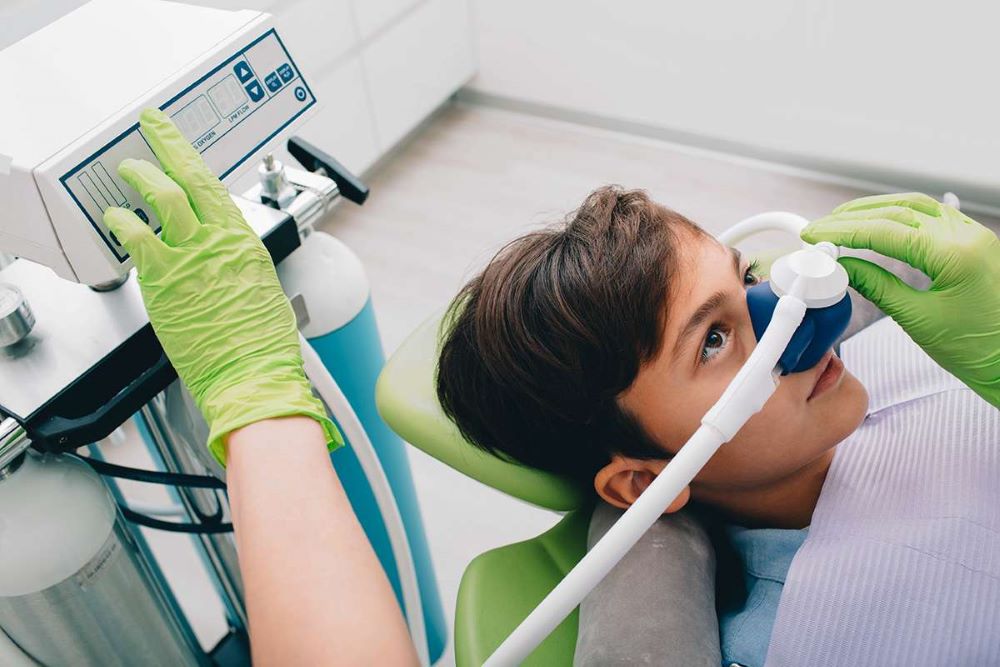 Child receiving safe dental sedation with nitrous oxide during Dental Sedation in Burlington.