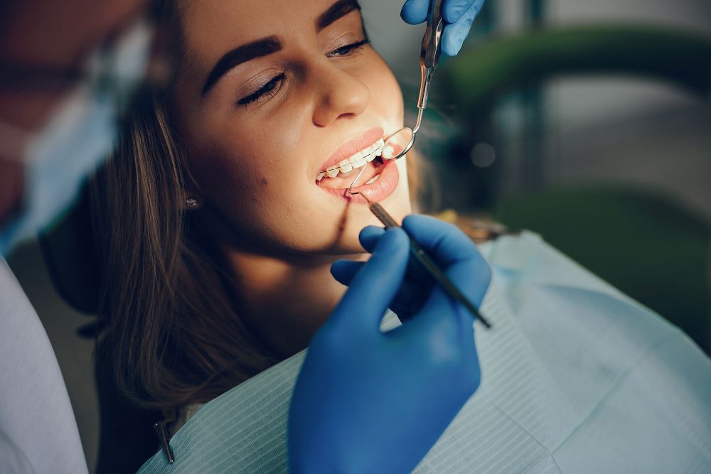 Orthodontic check-up to monitor braces or Invisalign progress for healthy, aligned teeth.